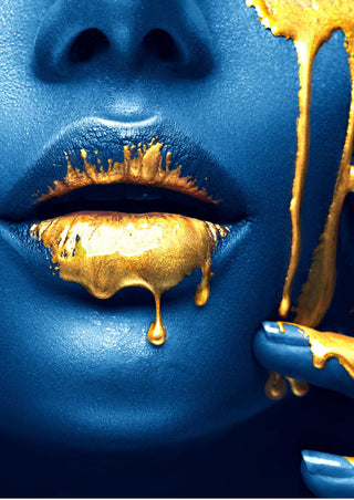 Close-up of golden lips and dripping gold paint on blue-painted skin, fashion art poster.