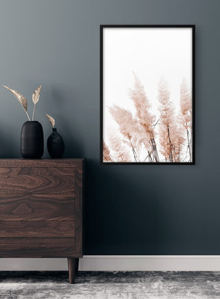 Abstract Reeds No. 3 Plakat featuring soft pink reeds, framed and displayed on a dark green wall above a dresser.