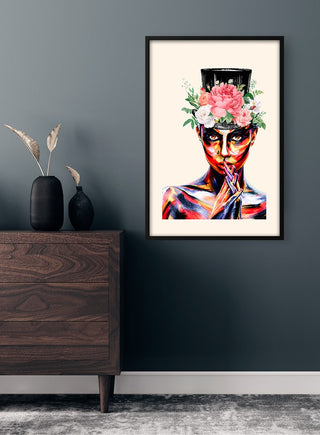 Framed "Sophisticated in color Plakat" art print on a dark wall above a wooden dresser with minimal decor.