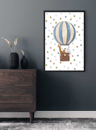 Wall art of a striped hot air balloon with animals in the basket, displayed above a wooden dresser.