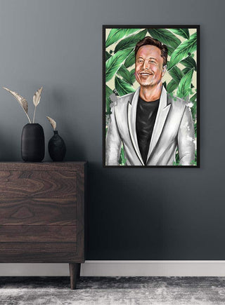 Framed portrait of Elon Musk in a gray blazer, smiling, with green leafy background on a dark wall.