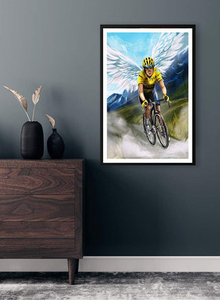 Framed Jonas Vingegaard poster by Danii Steinfeldt, showing a cyclist with angel wings riding on a mountain road.