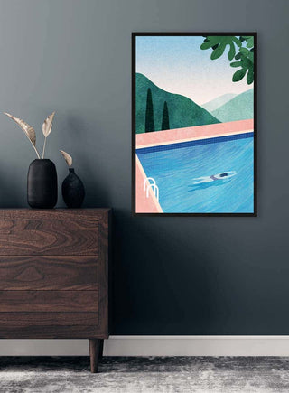 Framed "Swimming Pool" print by Henry Rivers displayed on a dark wall above a wooden dresser.