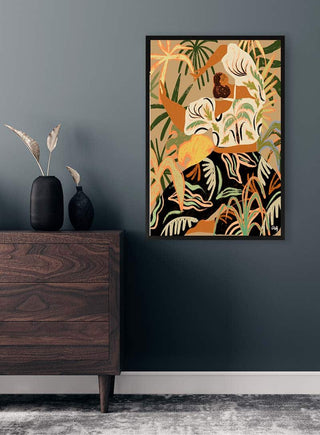 Framed Nature Embrace- Arty Guava artwork with abstract birds and foliage, hung above a wooden dresser.