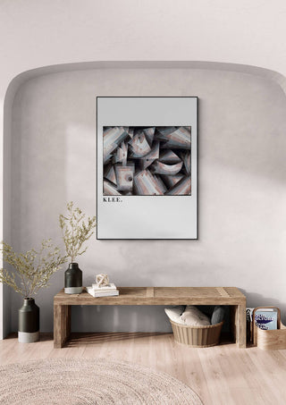 Framed "Crystal gradation 1921" by Paul Klee displayed above a wooden bench in a modern interior.