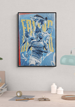 Framed Erling Haaland football poster featuring dynamic action poses and blue, yellow, and red accents on a wall.