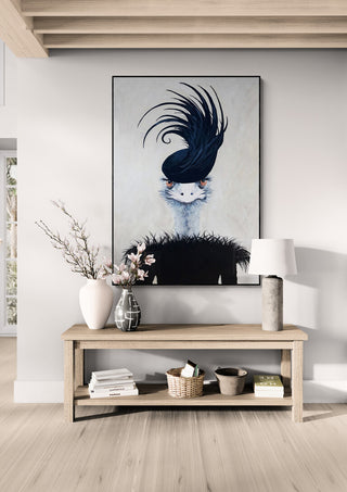 Large framed artwork of a whimsical ostrich with black feathers, styled for home decor by Coco de Paris.