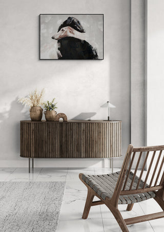 At All Times II by Gabriella Roberg displayed above a wooden sideboard in a modern, minimalist living room.