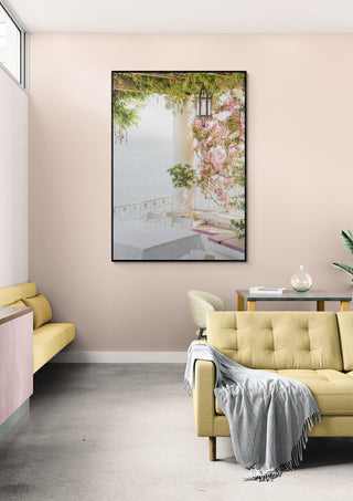 Framed Sorrento Vibes art print on a pastel living room wall, featuring a serene coastal terrace scene.