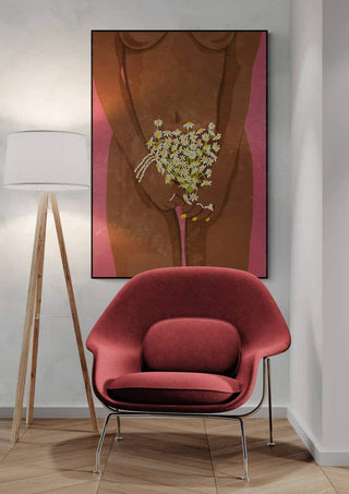 Framed "Wearing Flowers" by Raissa Oltmanns displayed above a red chair and floor lamp in a modern room.