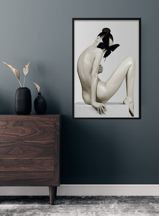 Lady Butterfly 2 poster featuring a nude woman seated with a butterfly on her face, displayed on a modern wall.