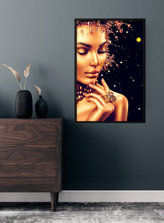 Golden fashion poster featuring an elegant woman with gold-toned skin, jewelry, and a starry background.