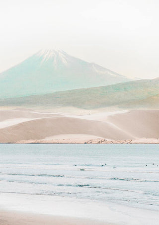 Minimalist print of a serene beach with gentle waves and a misty mountain in the background.