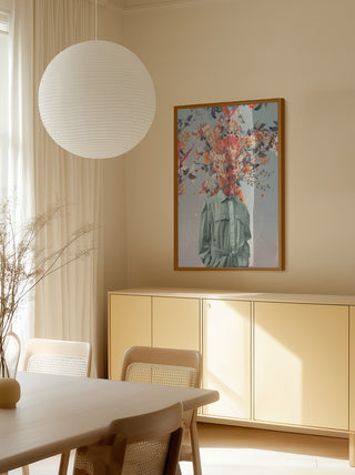 Framed "You Smell Like Home" by Frank Moth artwork hanging in a minimalist dining room with neutral decor.