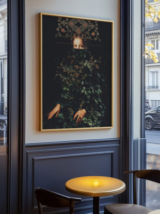 Framed "Patience II" by Frank Moth artwork displayed on a dark wall in a modern cafe setting.