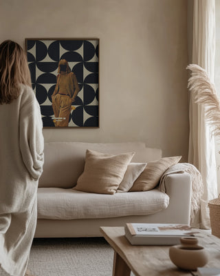 Framed "1978 Annie Collection" artwork by Frank Moth displayed above a neutral-toned sofa in a cozy living room.