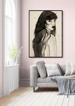 Framed "Long Hair Lady" by Raissa Oltmanns artwork displayed above a grey sofa in a modern living room.