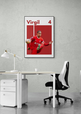Football poster of a player in red kit kicking a ball, displayed on office wall above desk and chair.
