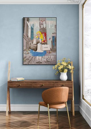 Framed "Lost In The City" by Daniel Leo displayed above a wooden desk in a stylish modern room.