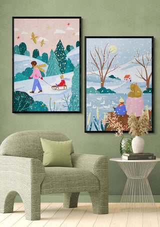 Framed prints of Mother and Child At Winter Lake by Bea Muller displayed on a green wall above a modern chair.