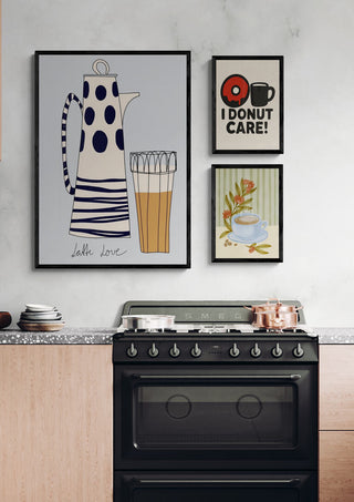 Modern kitchen with coffee-themed wall art above a stove, featuring playful mugs and coffee pot illustrations.