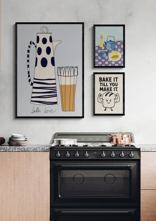 Modern kitchen setup with a black stove, wooden cabinets, and breakfast-themed wall art above the counter.