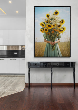 Framed Golden Bloom by Annika Persson displayed above a black table in a modern home interior.